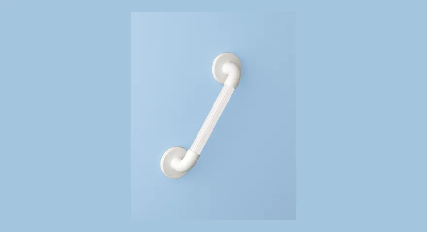 White fluted plastic straight grab rail mounted on a pale blue bathroom wall